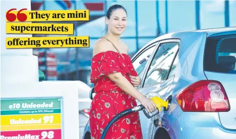  ?? Picture: SHAE BEPLATE ?? CONVENIENC­E KEY: Rebecca Williams from Bohle Plains fills up at the new Liberty petrol station on Charters Towers Rd.