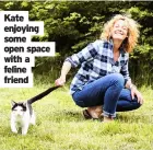  ??  ?? Kate enjoying some open space with a feline friend