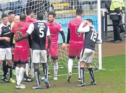  ??  ?? Raith’s Ross Matthews, No 12, can clearly be seen holding his head during the weekend’s match against Dundee United.