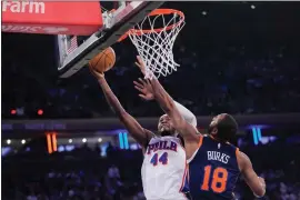  ?? MARY ALTAFFER — THE ASSOCIATED PRESS ?? Philadelph­ia 76ers forward Paul Reed (44) goes to the basket against New York Knicks guard Alec Burks (18) during the first half of an NBA basketball game Tuesday, March 12, 2024, at Madison Square Garden in New York.