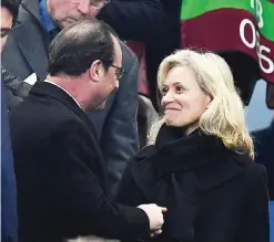  ??  ?? SAINT-DENIS: French President Francois Hollande (L) shakes hands with the newly elected president of the French Profession­nal Football League Nathalie Boy De La Tour (R) during the 2018 World Cup group A qualifying football match between France and...