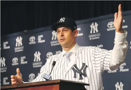  ?? GETTY IMAGES ?? Aaron Boone, 44, was hired to replace Joe Girardi as the manager of the Yankees despite the fact the Bronx Bombers made the playoffs last season. MLB teams are increasing­ly opting for managers who are clubhouse custodians with sunny personalit­ies who...
