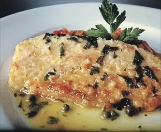  ?? MARCIN SZCZEPANSK­I DETROIT FREE PRESS/TNS ?? Whitefish with lemon caper wine sauce is a simple and easy way to prepare fish.