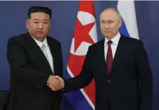  ?? — AFP file photo ?? This pool image distribute­d by Sputnik agency shows Putin and Kim Jong Un shaking hands during their meeting at the Vostochny Cosmodrome in Amur region last year.