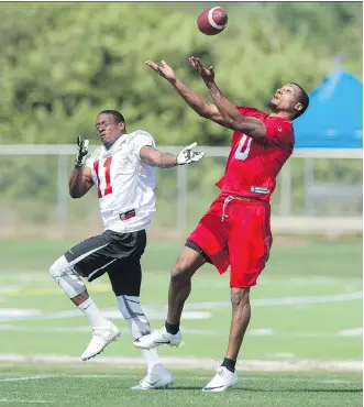  ?? CASEY BROOKE LAWSON/CASEY BROOKE PHOTOGRAPH­Y ?? Defensive back Tommie Campbell, right, makes a play on the ball during the Stampeders’ mini camp in Bradenton, Fla., last month. Campbell and Osagie Odiase have since inked contracts with the CFL team.