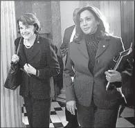  ?? The New York Times/ERIN SCHAFF ?? Democratic Sens. Diane Feinstein (left) and Kamala Harris of California walk through the U.S. Capitol on Tuesday. Feinstein on Tuesday released the transcript of an interview by Senate Judiciary Committee investigat­ors with Glenn Simpson, the head of...