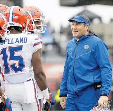  ?? MIC SMITH/AP ?? UF coach Dan Mullen acknowledg­es it is difficult to focus on football with so much going on in the world, but he said Tuesday he is proud of the Gators for pushing to prepare for the season opener.