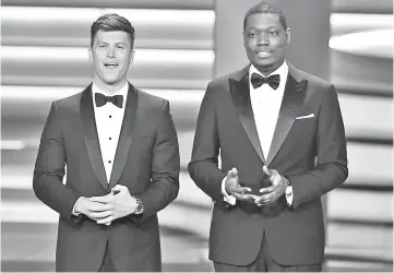  ??  ?? Host Jost (left) and Che speak onstage during the 70th Emmy Awards on Monday. — AFP photo