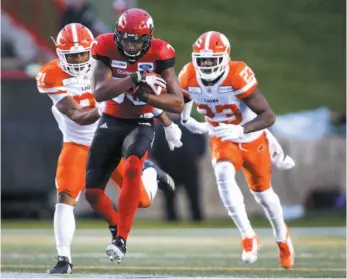  ?? CP FILE PHOTO ?? Otha Foster III, left, and B.C. Lions teammate Anthony Thompson chase ball carrier Kamar Jorden during the second half of a game against the Calgary Stampeders on Aug. 4. The Lions (7-7) visit the Calgary Stampeders (12-2) tonight.