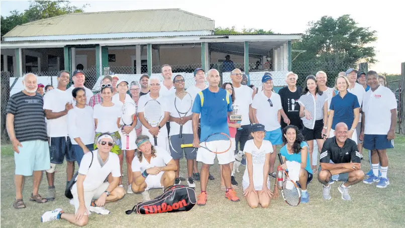  ?? FILE ?? In this file photo from November 2018, former Gleaner Company Media Limited chairman and managing director Oliver Clarke (back left) is pictured with the rest of his Racquet-eers Tennis Club teammates. Clarke, who passed away at his home in St Andrew on Saturday, was an avid tennis fan.