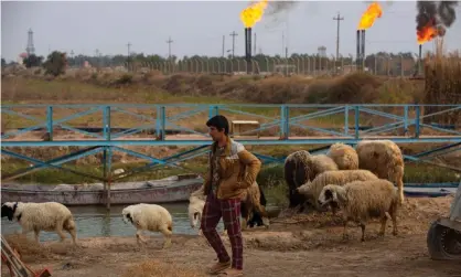  ?? Photograph: Hussein Faleh/AFP/Getty Images ?? Iraq is one of the poor countries reliant on fossil fuel production that should be given until 2050, the report says.