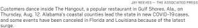  ?? JAY REEVES — THE ASSOCIATED PRESS ?? Customers dance inside The Hangout, a popular restaurant in Gulf Shores, Ala., on Thursday, Aug. 12. Alabama’s coastal counties lead the state in new COVID-19cases, and some events have been canceled in Florida and Louisiana because of the latest surge.