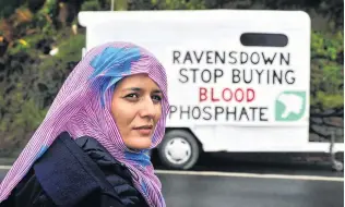  ?? PHOTO: CHRISTINE O’CONNOR ?? Speaking out . . . Visitor Tecber Ahmed Saleh, with a protest message about the Ravensdown fertiliser plant in Dunedin.