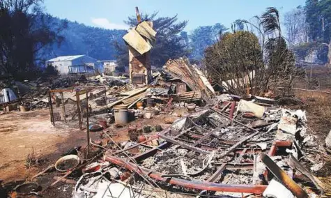  ?? Reuters ?? Debris of burnt houses near the town of Cobden, located southwest of Melbourne, yesterday. The Bureau of Meteorolog­y Victoria issued fire weather warnings for Victoria, the Australian Capital Territory and the eastern state of New South Wales.