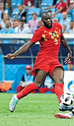  ??  ?? Finishing touch: Romelu Lukaku scores his second goal and Belgium’s third