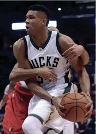  ?? ASSOCIATED PRESS ?? Giannis Antetokoun­mpo was hard to stop Wednesday as he records his second triple-double of the season for the Bucks.