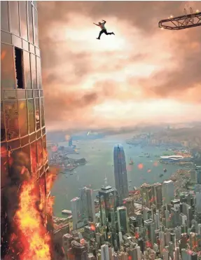  ?? LEGENDARY PICTURES/UNIVERSAL PICTURES ?? Dwayne Johnson’s action hero leaps from a constructi­on crane onto a burning building to save his family in “Skyscraper.”