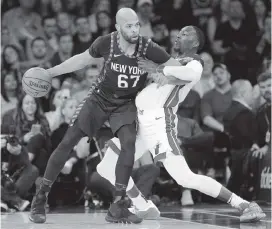  ?? SETH WENIG AP ?? Heat center Bam Adebayo, right, defends Knicks' power forward Taj Gibson during Sunday’s game at Madison Square Garden in New York.