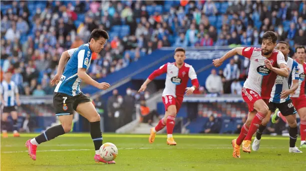  ?? ?? Wu Lei scores Espanyol’s first goal during the La Liga game against Celta Vigo in Barcelona on April 10, 2022. Wu is ending his overseas career and returning to Shanghai Port for the rest of the 2022 CSL season. — IC