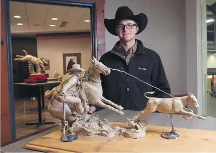  ?? PHOTOS: GAVIN YOUNG ?? Artist Shay Keller displays one of his entries in this year’s Calgary Stampede Champion Trophy Bronze competitio­n at Stampede Park on Thursday. Almost 200 sculptures from 27 artists are on display and in the running to be chosen as prestigiou­s Stampede...