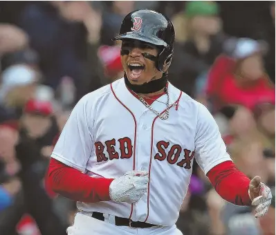  ?? STAFF PHOTO BY NANCY LANE ?? ON A ROLL: Mookie Betts celebrates after scoring the go-ahead run in the bottom of the eighth inning yesterday at Fenway.