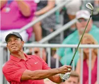  ?? AP ?? Tiger Woods follows his shot from the rough on the seventh hole during the final round of the Memorial golf tournament. —