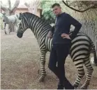  ??  ?? Brendan chills with the resort zebra