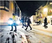  ?? ?? Police patrol the streets of Kongsberg after Wednesday’s attack in which five people died and two others were wounded