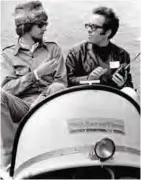  ??  ?? In this June 16, 1967 photo, co-producer John Phillips, left, talks with Alan Pariser, right, at the Monterey Pop Festival in Monterey, Calif.