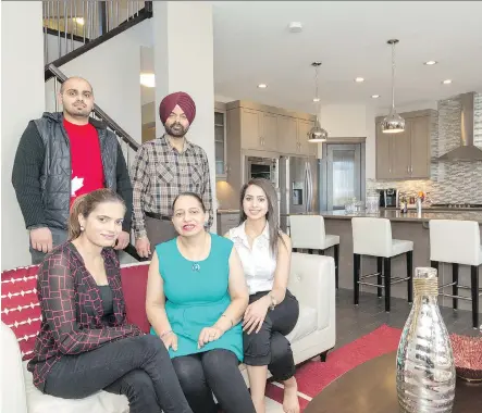  ?? MICHELLE HOFER ?? Back row, Sukhbir Singh Bains and Charanjeet Singh Bains. Front row, Sukhbir Kaur, Baljinder Kaur and Simranjeet Kaur Bains. With keeping the family together a priority, Pacesetter by Sterling Homes’ Santiago 5 model in Redstone fit their needs.