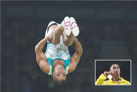  ?? Picture: AFP PHOTO ?? Christophe­r Remkes, who was adopted from the Philippine­s as a two-year-old, wins gold in the men's vault.