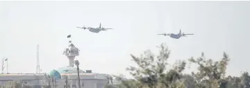  ??  ?? Military planes fly during an Iraqi military parade in Baghdad, Iraq. — Reuters photo