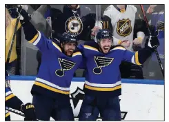  ?? AP/TOM GANNAM ?? David Perron (left) and Tyler Bozak of the St. Louis Blues celebrate after Bozak’s goal in the third period of the Blues’ victory over the San Jose Sharks in Game 6 of their NHL playoff series Tuesday night.