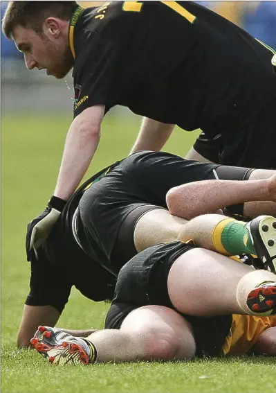  ??  ?? Ashford’s Aaron Nugent puts his head on the line against Hollywood in the IFC game at Joule Park, Aughrim.