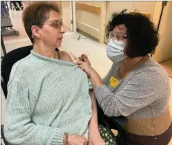  ?? PHOTO COURTESY ALBERTA HEALTH SERVICES ?? Sheila Veeder, 63, a resident of the Riverview Care Centre in Medicine Hat, is the first longterm care resident in Alberta to receive the Moderna COVID19 vaccine on Wednesday.