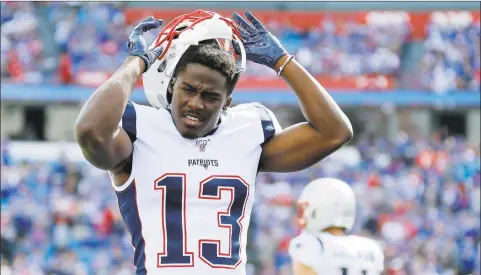  ?? Ron Schwane / Associated Press ?? New England Patriots wide receiver Phillip Dorsett warms up before an NFL game against the Buffalo Bills on Sept. 29 in Orchard Park, N.Y. Dorsett has carved out in niche in a group of wide receivers that has been everchangi­ng this season.