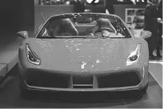  ??  ?? A Ferrari NV 488 Spyder luxury automobile stands on display on the second day of the 87th Geneva Internatio­nal Motor Show in Geneva in March. — WP- Bloomberg photos