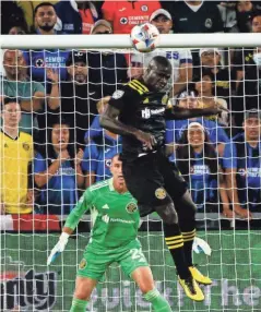  ?? JOSHUA A. BICKEL/ COLUMBUS DISPATCH ?? Crew defender Jonathan Mensah clears the ball against Cruz Azul on Wednesday. Columbus had 43 clearances, dealt with 11 corners and defended 34 crosses.