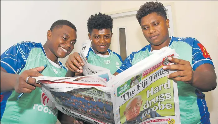  ?? Picture: BALJEET SINGH ?? Fijian Drua Women players Salanieta Nabuli (left), Litiana Lawedrau and Litia Marama go through The Fiji Times at Fijian Drua Home Base, Legalega Nadi.