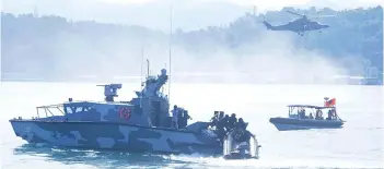  ?? ?? FIC G2000 Mk II demonstrat­es its capability in preventing cross-border criminal activity at the Royal Malaysian Navy Eastern Fleet Command in Sepanggar on Friday.
