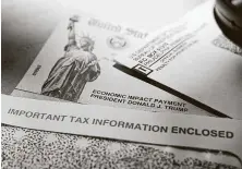  ?? Eric Gay / Associated Press ?? The government can’t logistical­ly or physically make all the stimulus payments at once, so it’s doing so in steps.