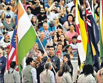  ?? PTI ?? India's flag-bearers Achanta Sharath Kamal and Nikhat Zareen during the closing ceremony of the CWG in Birmingham.