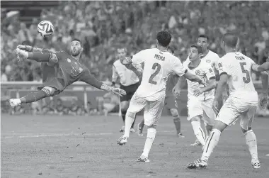  ?? CLIVE ROSE/GETTY Images ?? Sergio Ramos makes an overhead kick during the match between Spain and Chile at the Maracana on Wednesday.