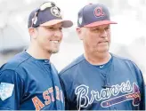  ?? AP FILE ?? Astros hitting coach Troy Snitker and his father, Braves manager Brian Snitker, are excited to face off in the World Series, which opened Tuesday night in Houston.