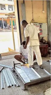  ?? ?? Inmates of the Nellore Central Prison making steel racks meant to store the Electronic Voting Machines (EVMs) in the high-security strongroom­s for the ensuing elections.