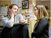  ?? KATHRYN GAMBLE / THE NEW YORK TIMES ?? Dr. Nicole Gastala (right) and Andrea Storjohann, a nurse and a Marshallto­wn native, discuss a plan for a patient in Marshallto­wn, Iowa. Gastala has folded addiction treatment into her regular family medical practice.