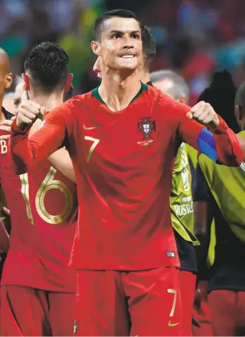  ?? AFP ?? Adrenaline plus: All pumped up is football ace Cristiano Ronaldo in the match against Spain. The Portugal captain scored a hattrick and helped his team draw 33 with its Iberian rival.