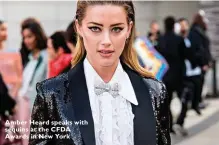  ??  ?? Amber Heard speaks with sequins at the CFDA Awards in New York