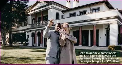  ?? ?? Hello to our new home: Adele and Rich Paul hold keys to the eight-bed Beverly Hills mansion the singer bought for $57million