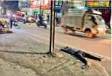  ?? — P. SURENDRA ?? A drunkard lies flat on the road after drinking in Sitaphalma­ndi on Thursday.